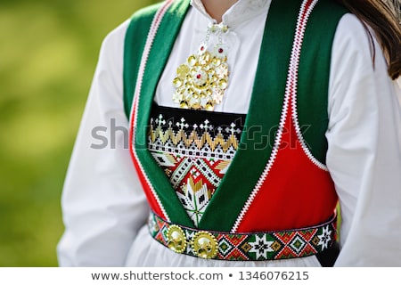 a girl wearing Bunad on national day of Norway